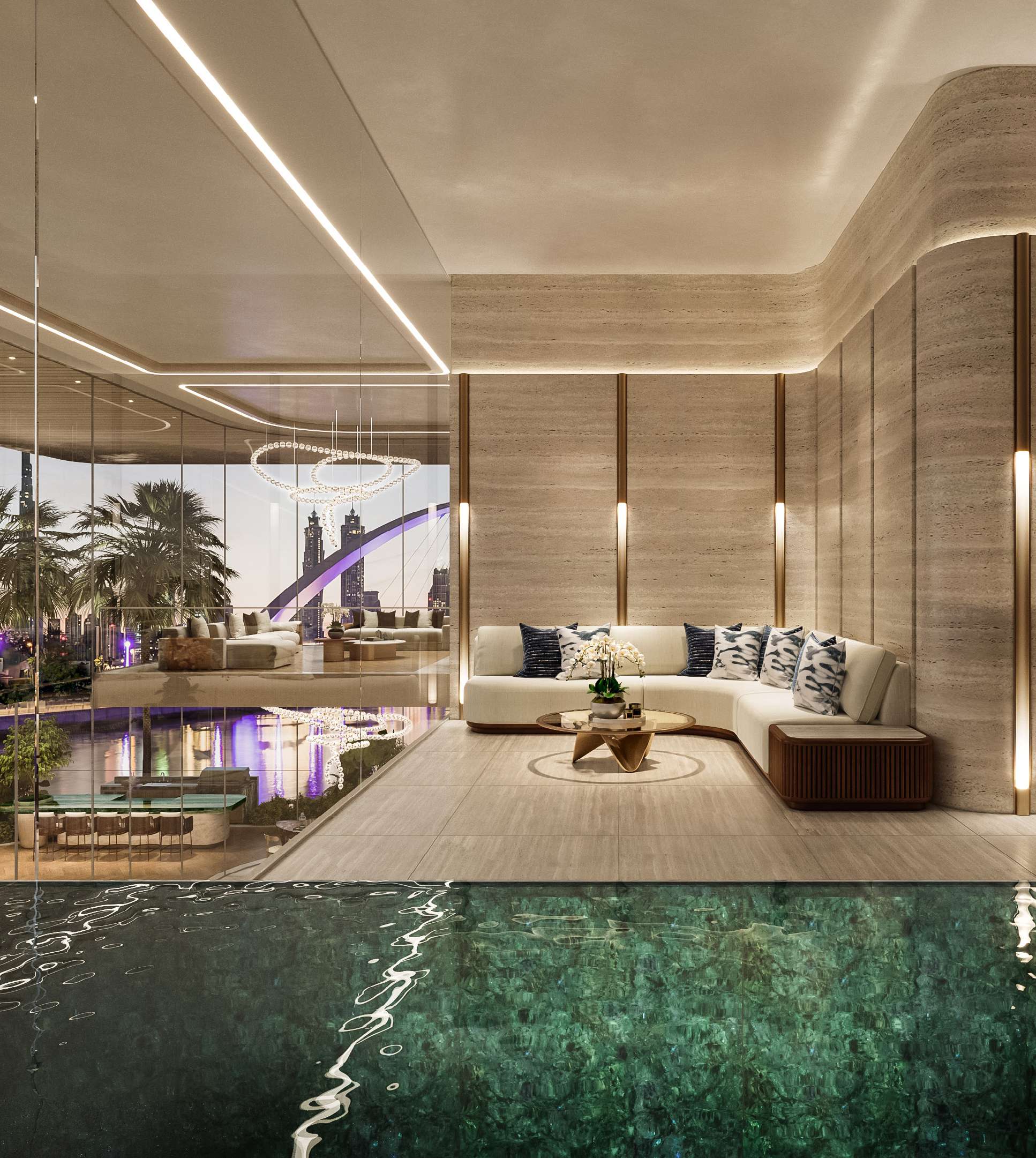Penthouse lap pool and lounge in travertine, overlooking the lit canal bridge